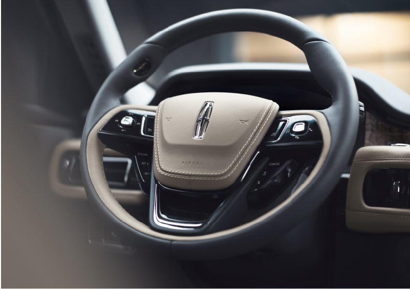 The intuitively placed controls of the steering wheel on a 2023 Lincoln Aviator® SUV | Bayway Lincoln in Houston TX