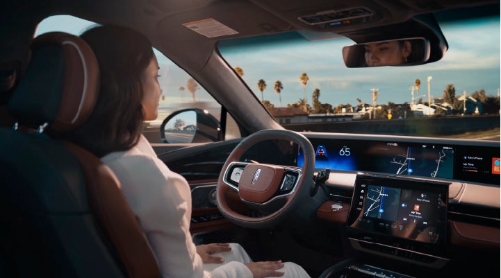 A person is shown driving hands-free on the highway with available Lincoln BlueCruise technology. | Bayway Lincoln in Houston TX